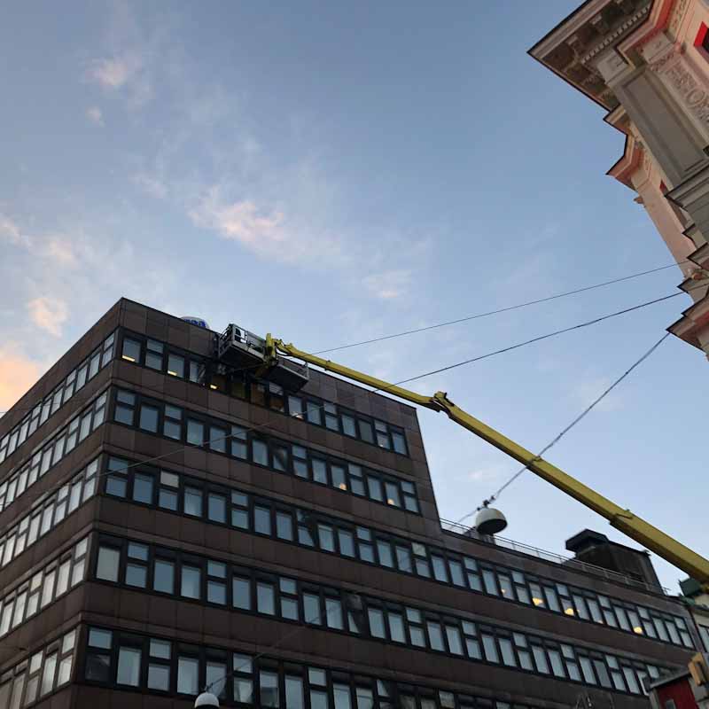 Sign installation using a crane