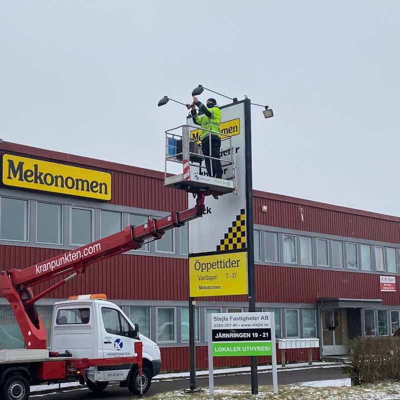 Mounting an illuminated sign